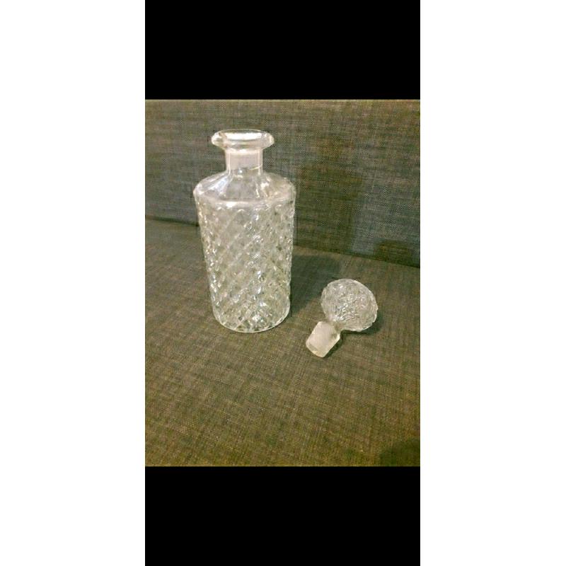 Decanter and 2 matching brandy glasses in dark wood display stand