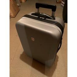 Silver medium sized hard shell suitcase