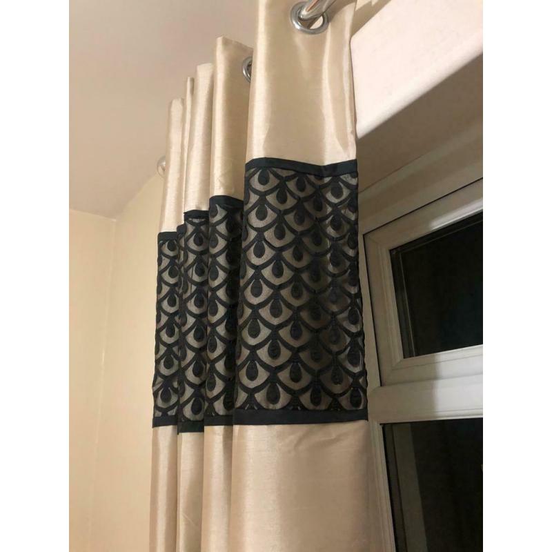 Gold and black matching curtains and bedding will accept offers