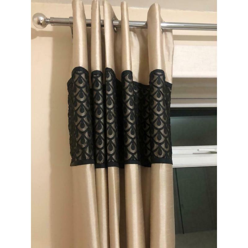 Gold and black matching curtains and bedding will accept offers